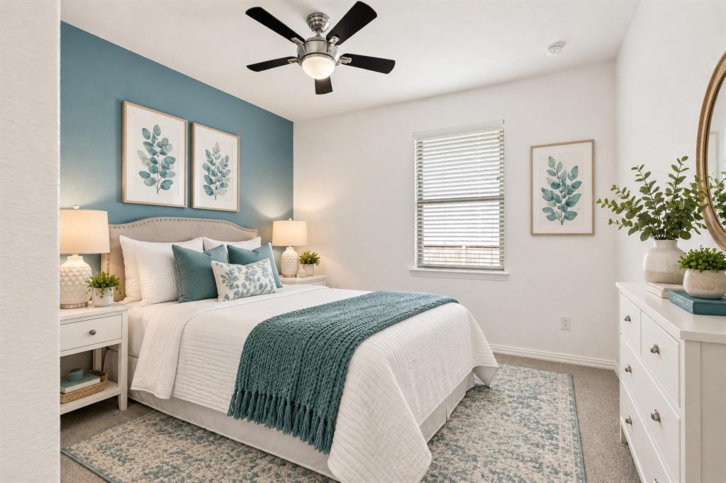 Accent wall featuring a blue-toned finish, central ceiling fan with integrated lighting, window with adjustable horizontal blinds, and neutral carpeting