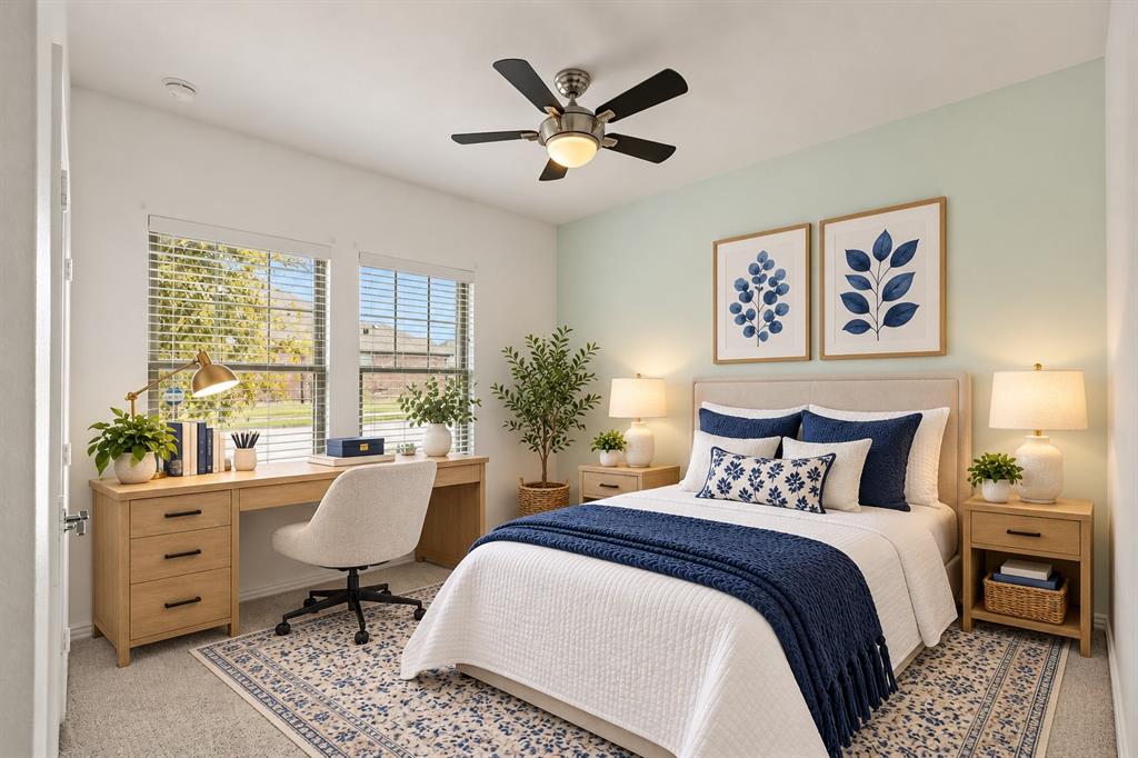 Bedroom featuring carpeted flooring, dual-pane windows, and a ceiling fan with integrated lighting. Virtual photo