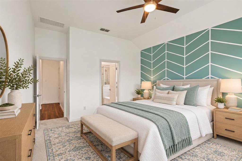 Vaulted ceilings, geometric accent wall, and ceiling fan with integrated lighting. Virtual photo