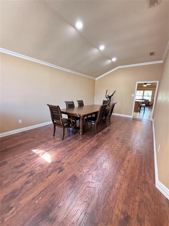 Vaulted ceilings, wood-finish flooring, and crown molding