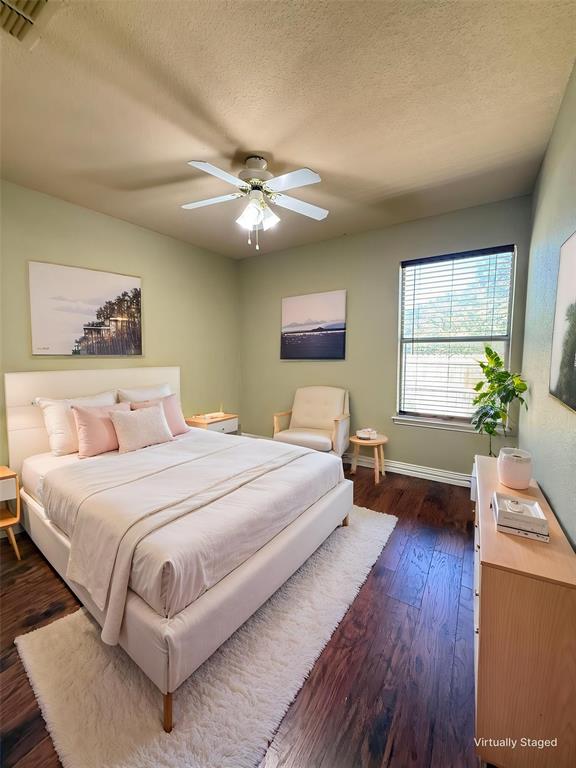 Wood-finish flooring, central ceiling fan with integrated light fixture, and horizontal window blinds