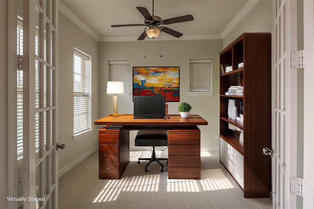 Room featuring French doors, ceiling fan with integrated lighting, and carpeted flooring