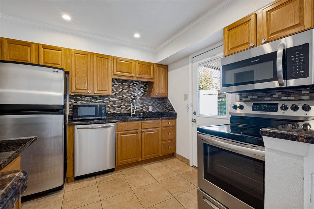 Enter the kitchen from the backdoor. Convenient from the parking spot under the carport. Granite counter tops. Enter the kitchen from the backdoor. Convenient from the parking spot under the carport. Granite counter tops.