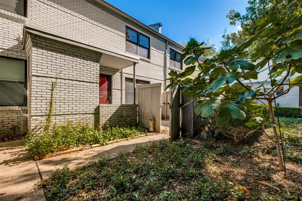 Red door is the front door of Unit # 8812, a small courtyard is fenced in for this unit.