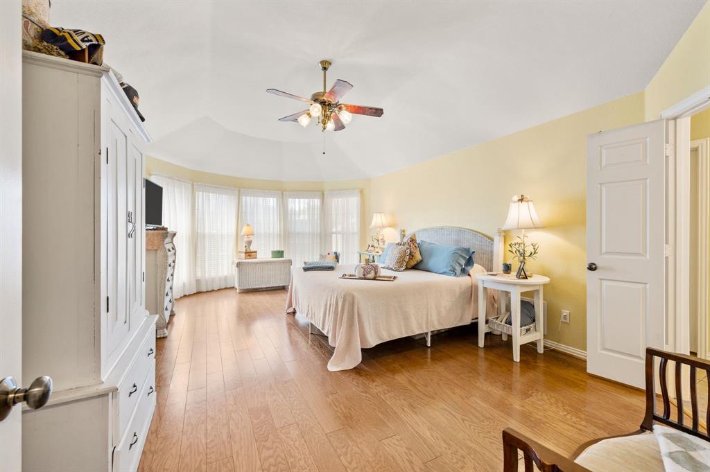 Huge primary bedroom with bay window and seating area