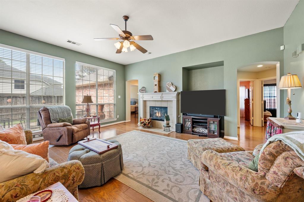 Large family room has fireplace with gas logs