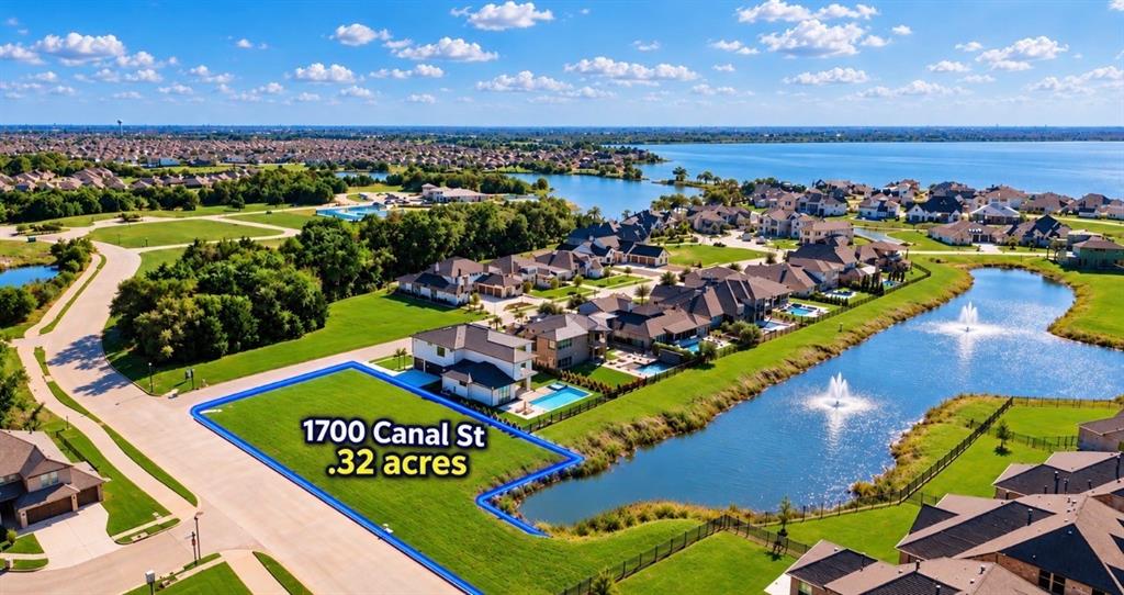 Aerial perspective of a .32-acre lot featuring direct waterfront access, pond frontage, and proximity to a large-scale water body