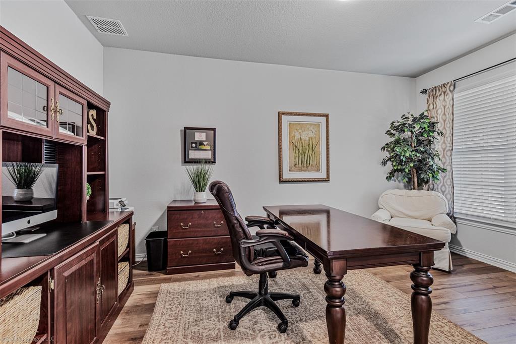 Office with light wood finished floors