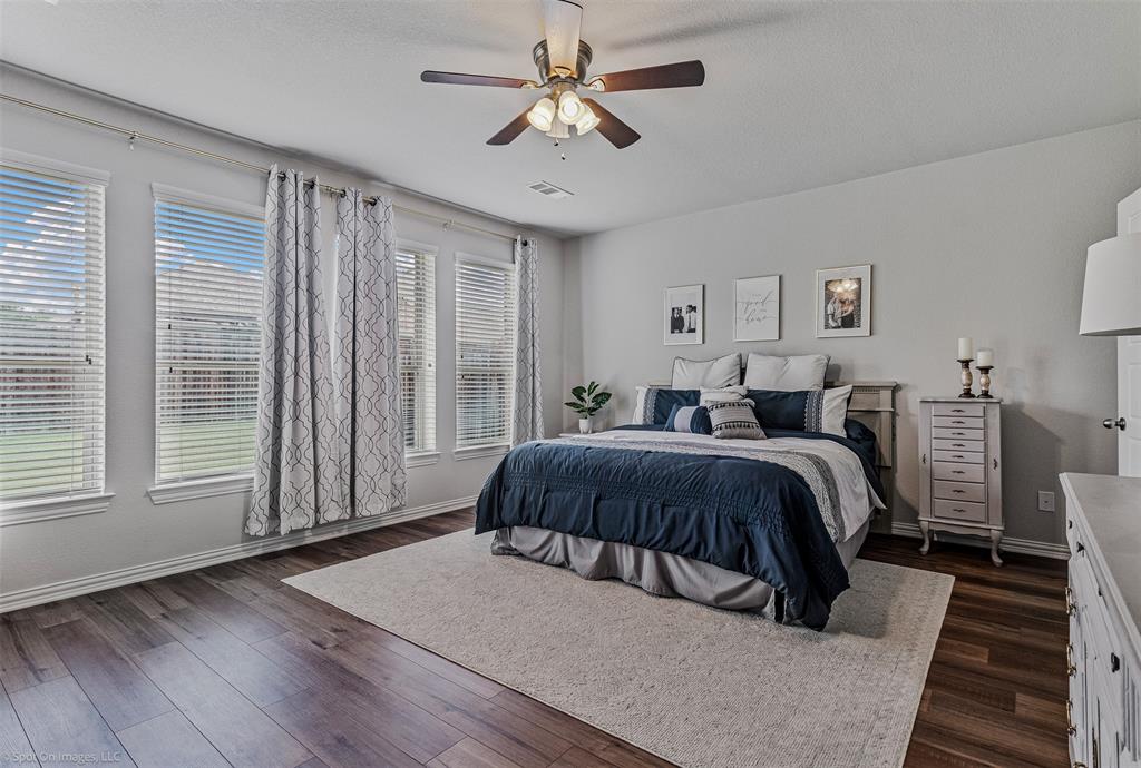 Bedroom featuring dark wood finished floors and a ceiling fan