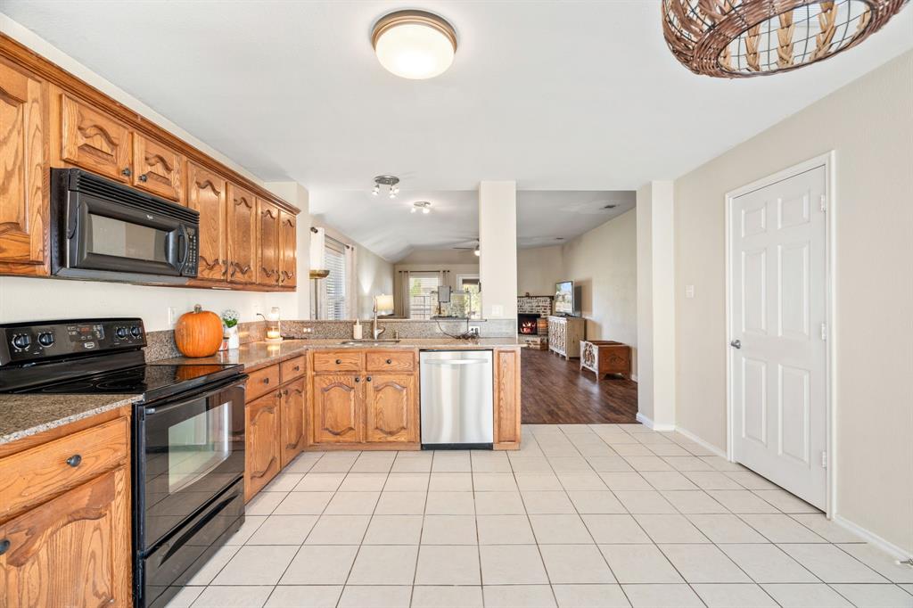 The kitchen sink overlooks the dining area and family room