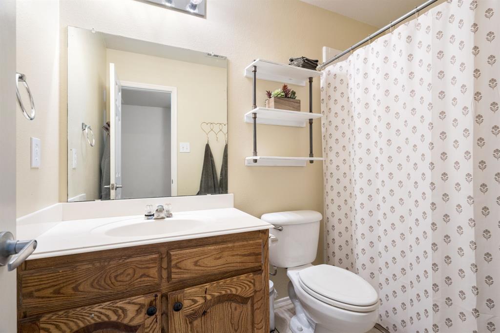 The full hallway bath has easy access from both additional bedrooms.