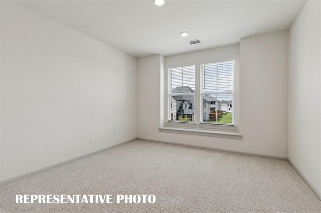 You'll find nicely sized secondary bedrooms in our Rennes plan.  REPRESENTATIVE PHOTO