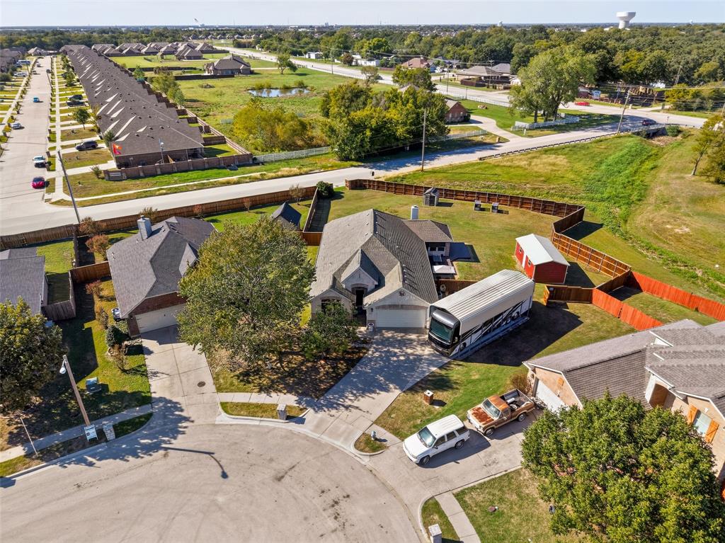Aerial perspective of a property showing it backs up to no neighbors, and access to the double gates.  BRING ALLLLL YOUR TOYS!  NO NEED TO PAY A STORAGE FEE ANYMORE!