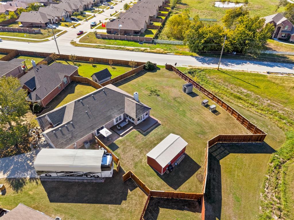 Great aerial showing the size of this RV carport/extra parking!