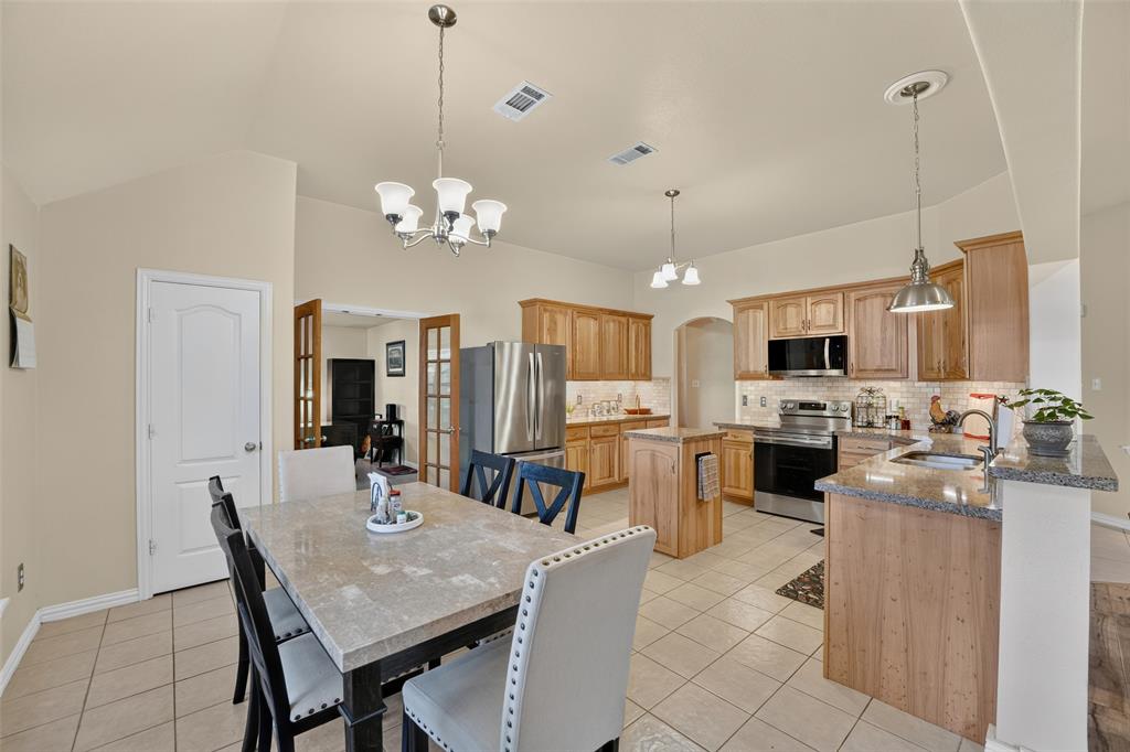 This Kitchen was made for a lot of good cooking using the stainless steel appliances - fridge conveys!