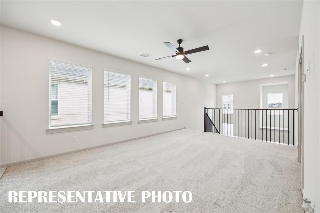 Light, bright and spacious, your new game room, paired with adjacent media room, is the perfect place to host those big game day parties!  REPRESENTATIVE PHOTO