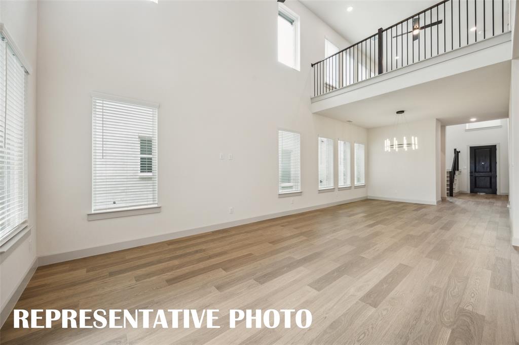 Offering a game room open to the family room below, you'll enjoy a dual level entertainment zone in this dream home.  REPRESENTATIVE PHOTO