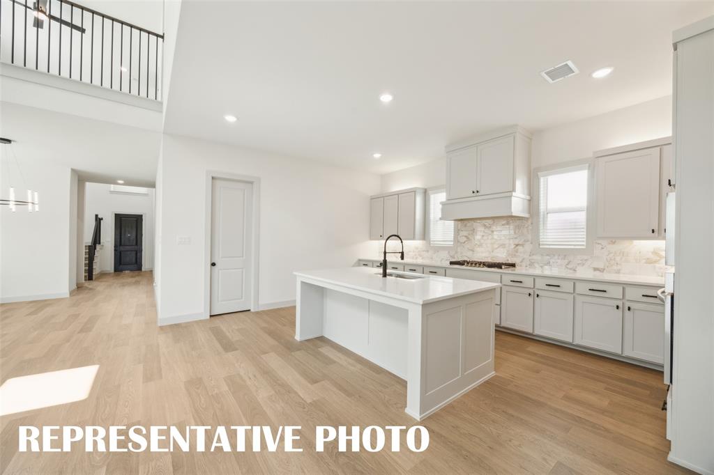 With a floor plan designed for entertaining, the chef in the family will never be left out of the party in this wonderful home!  REPRESENTATIVE PHOTO