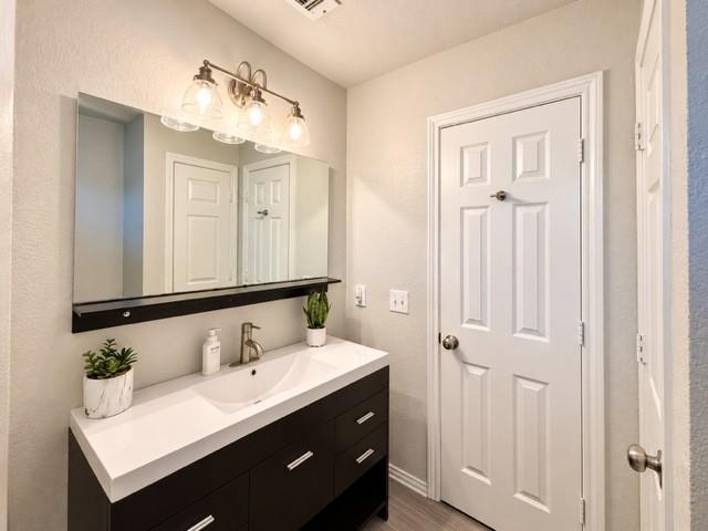 Secondary bath vanity linen closet