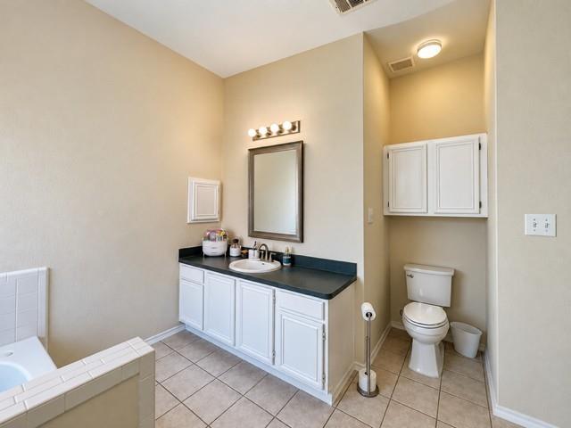 Cabinets and plenty of vanity storage natural light