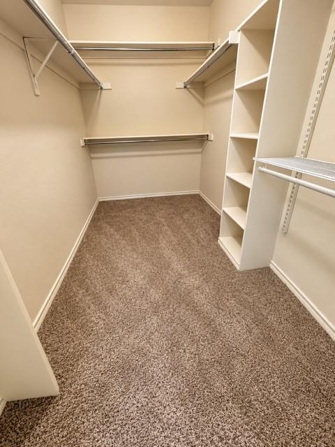 Master bedroom very spacious closet with built ins