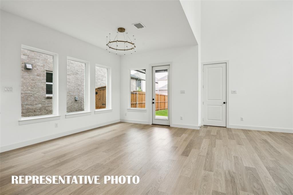With a spacious dining room and easy access to the lovely covered back patio, it's easy to dine inside or out in this beautiful home  REPRESENTATIVE PHOTO