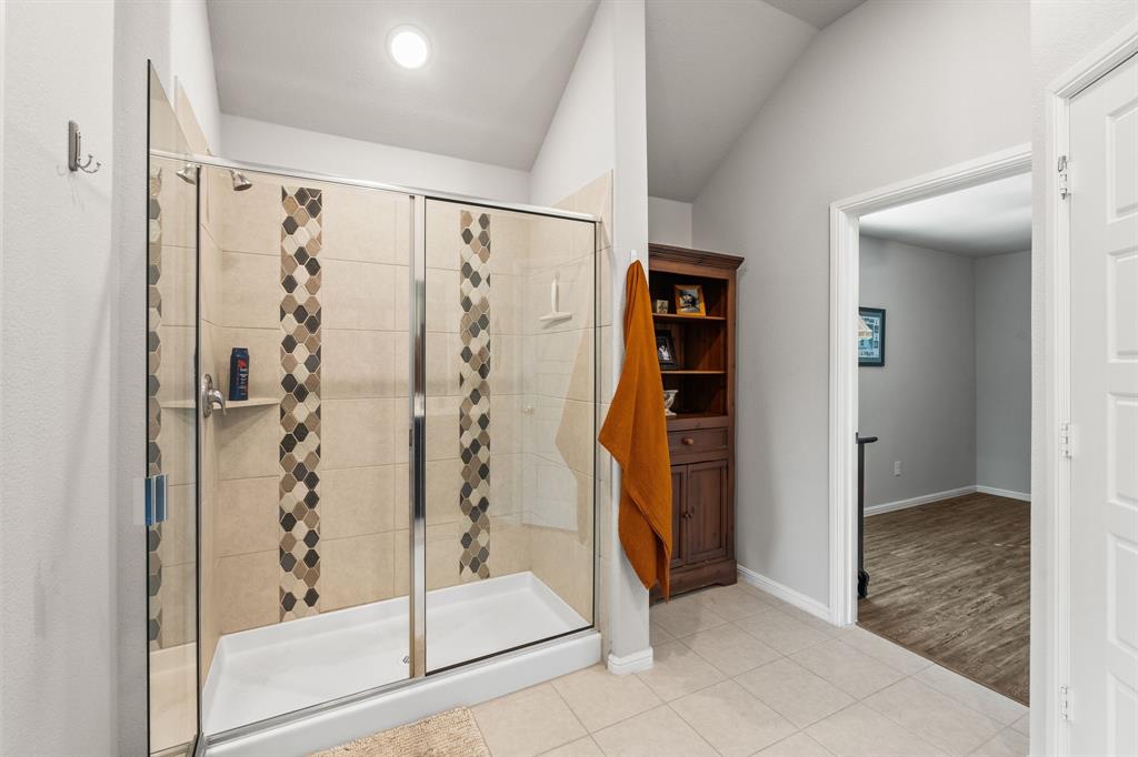 Upgraded walk in shower and area for shelving or storage
