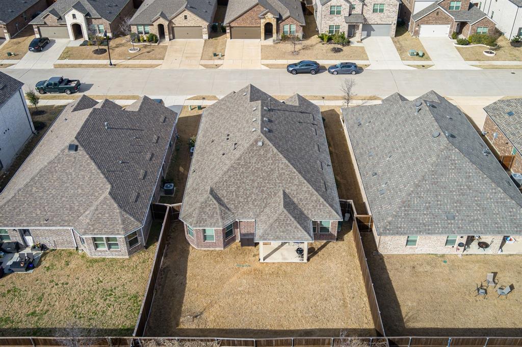 View of the back of home and backyard