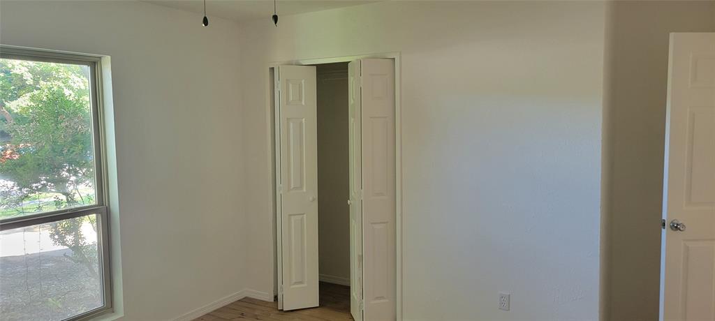 primary bedroom with walk in closet