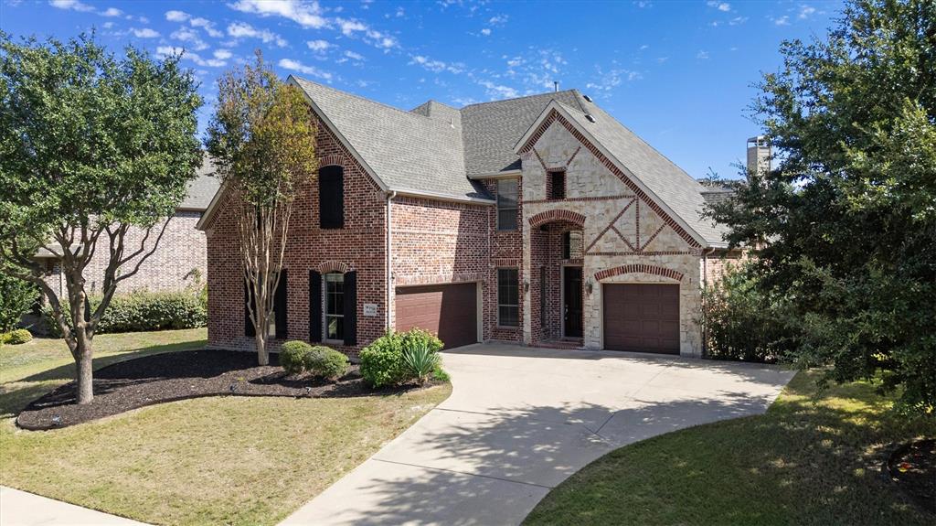 Beautiful 3 car garage, brick and stone exterior built by Shaddock Homes. Beautiful 3 car garage, brick and stone exterior built by Shaddock Homes.