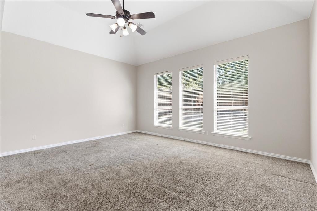 Enjoy the natural light in this beautiful primary bedroom.