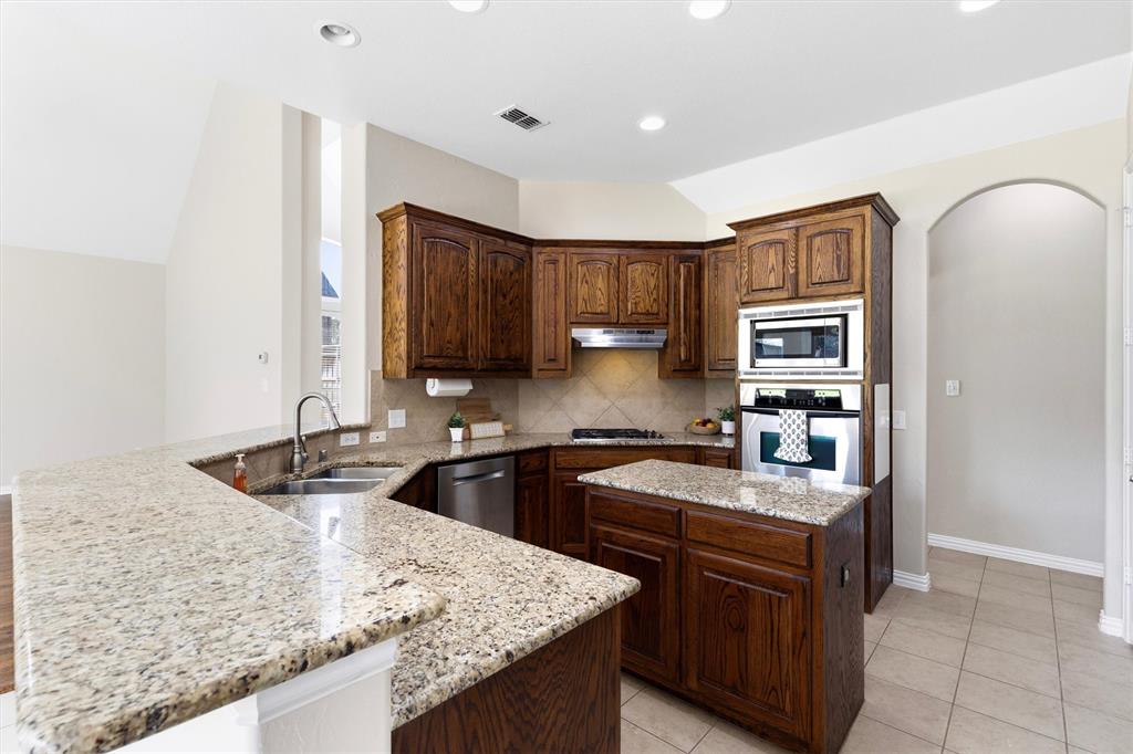 Plenty to counterspace. Enjoy the ease of granite countertops.