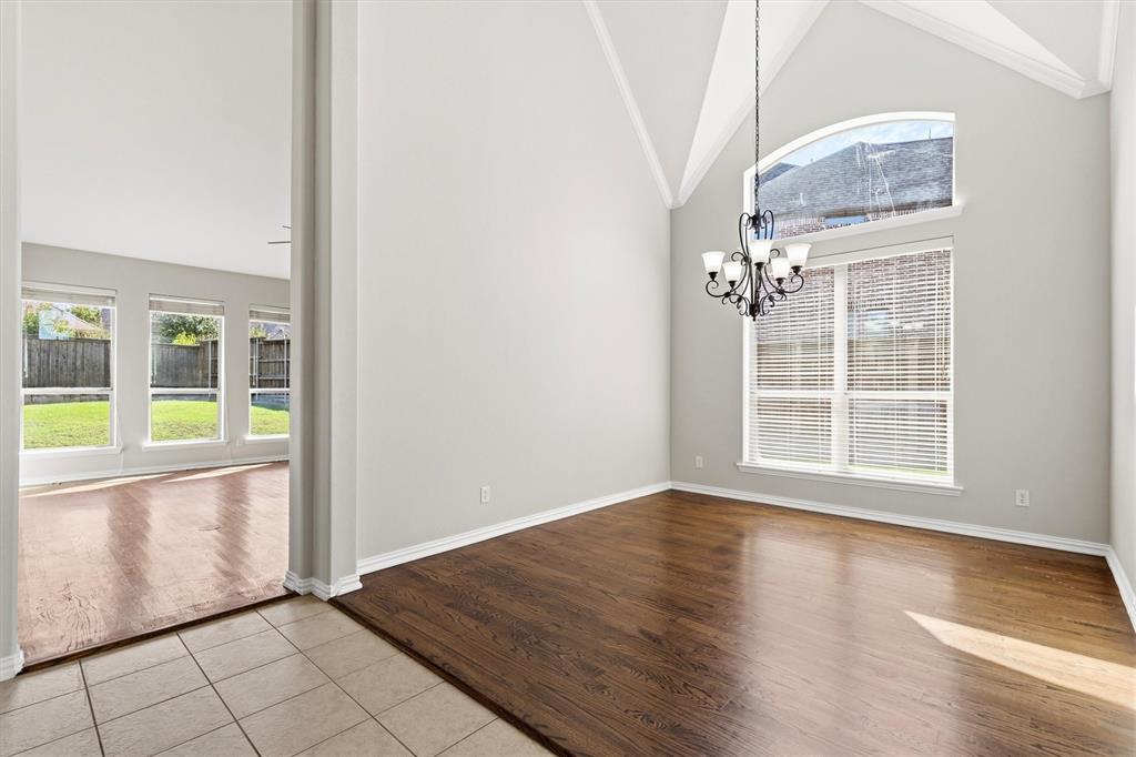 Dining area off the living room and kitchen. Beautiful hardwood floors