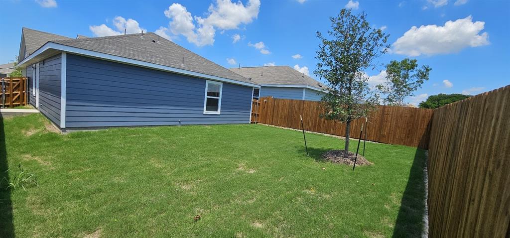 View of fenced backyard