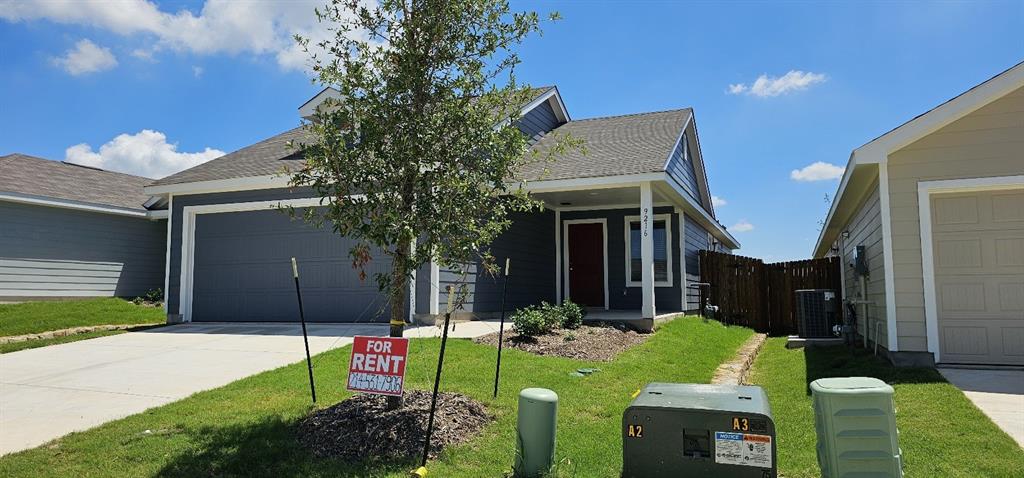 View of front of house with a shingled roof, driveway, a porch, and an attached garage