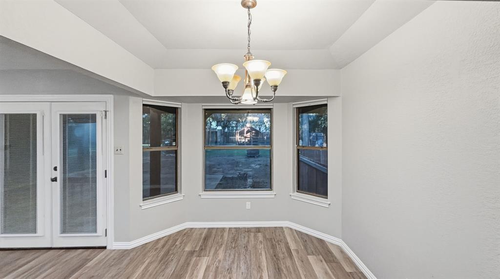 Breakfast area with windows to backyard
