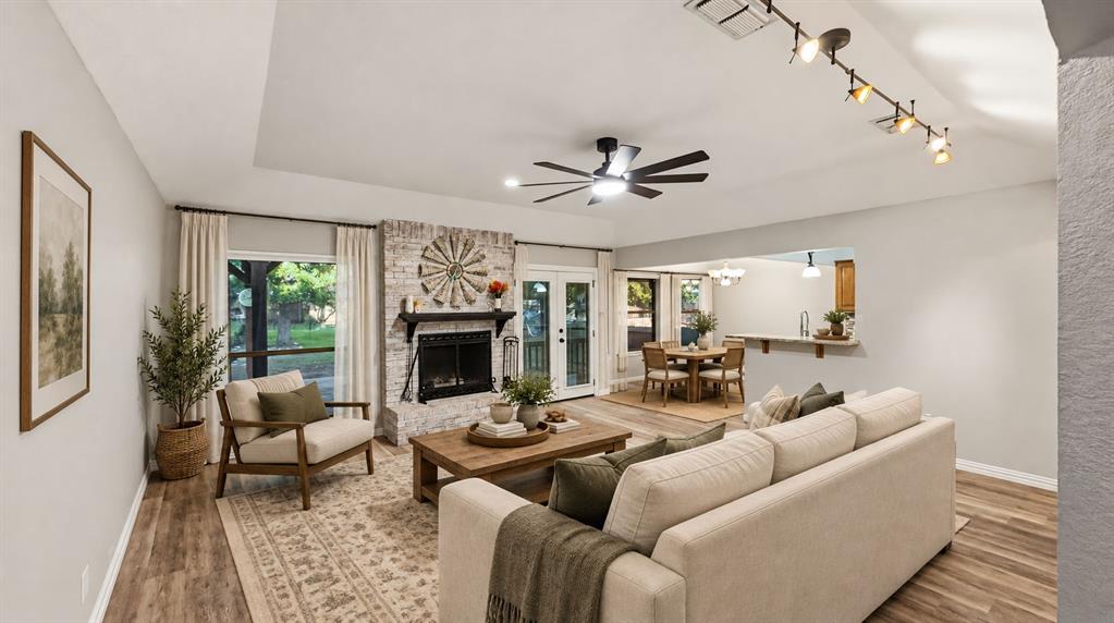 Large open living room with brick fireplace