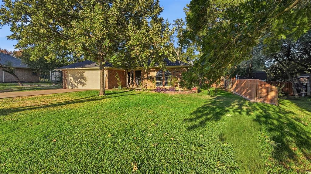 Full sod grass and large mature trees!