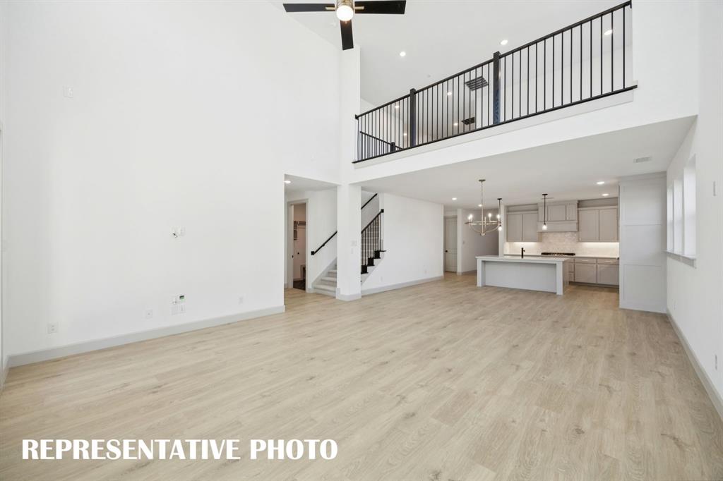 Our Versailles plan features a game room with open railing that overlooks the family room below creating a multi-level entertainment area! REPRESENTATIVE PHOTO Our Versailles plan features a game room with open railing that overlooks the family room below creating a multi-level entertainment area! REPRESENTATIVE PHOTO