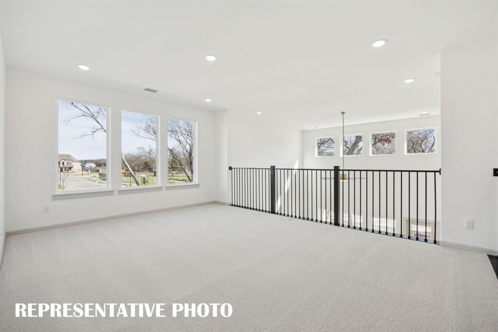 Open and airy, you'll find plenty of space for family fun in this outstanding game room!  REPRESENTATIVE PHOTO