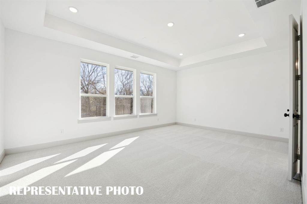 Located at the rear of the home for additional privacy, this dreamy owner's suite was designed for rest and relaxation! REPRESENTATIVE PHOTO Located at the rear of the home for additional privacy, this dreamy owner's suite was designed for rest and relaxation! REPRESENTATIVE PHOTO