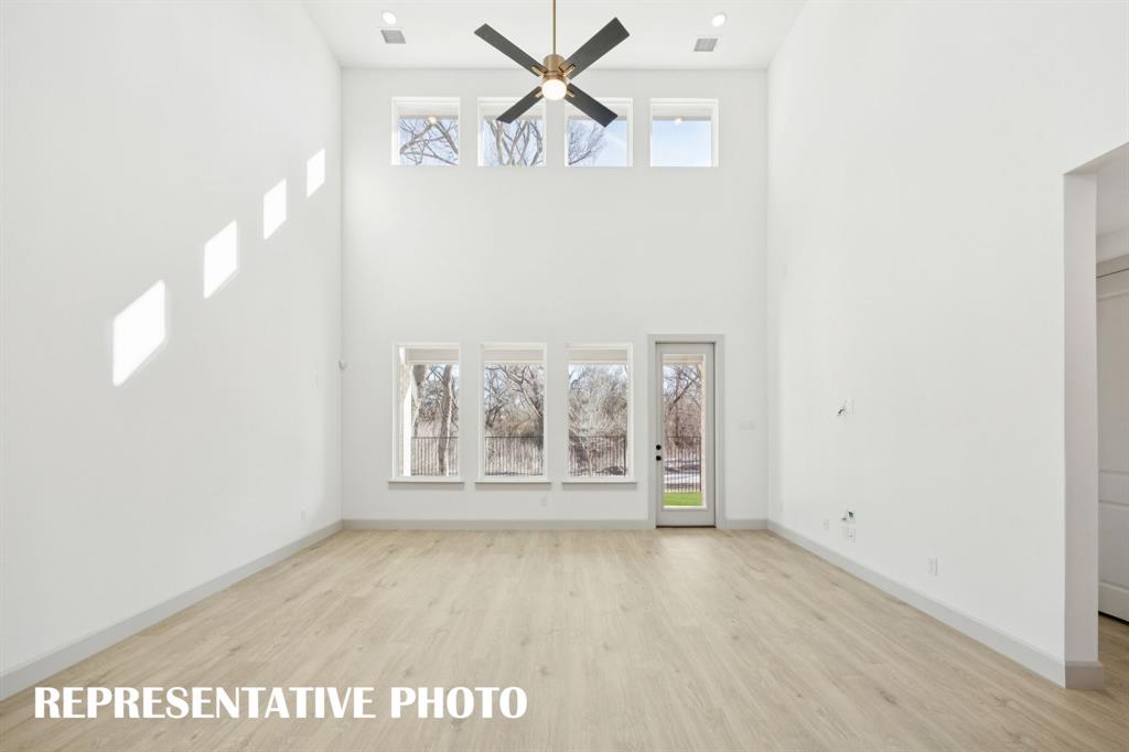Your new family room is flooded with natural light from a double stacked wall of windows! REPRESENTATIVE PHOTO Your new family room is flooded with natural light from a double stacked wall of windows! REPRESENTATIVE PHOTO
