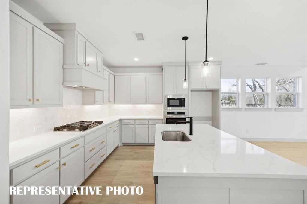 Beautiful cabinetry, gorgeous countertops and designer backsplash effortlessly pair with contemporary stainless steel to create a kitchen for the ages! REPRESENTATIVE PHOTO Beautiful cabinetry, gorgeous countertops and designer backsplash effortlessly pair with contemporary stainless steel to create a kitchen for the ages! REPRESENTATIVE PHOTO