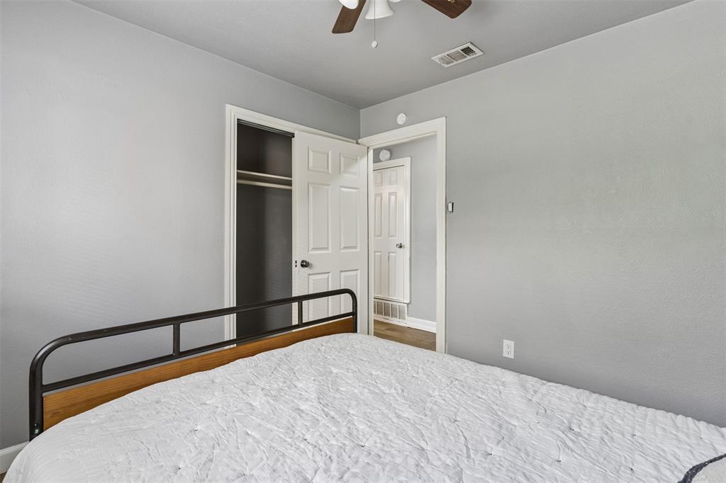 Interior space featuring neutral-toned walls, a closet with a six-panel door, and a ceiling fan with integrated lighting
