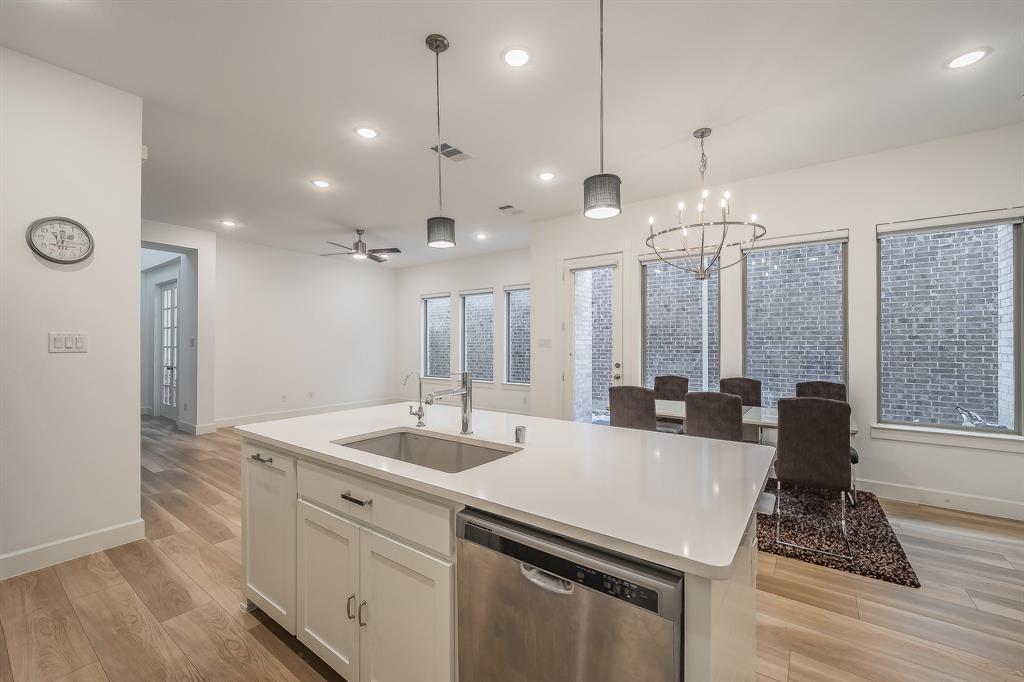 Kitchen island Holds the sink, dishwasher and pull-out garbage for convenience and cleanliness