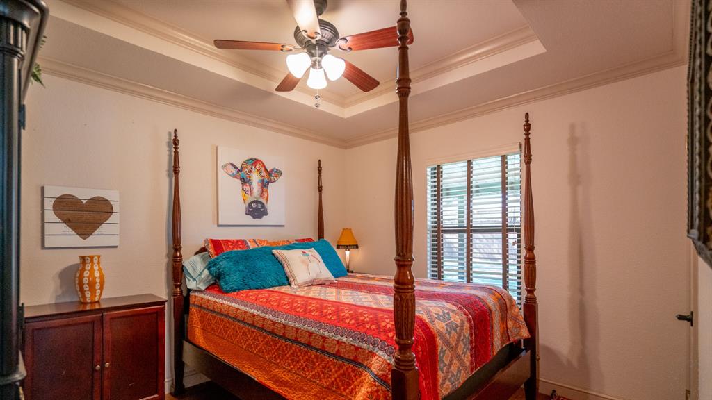 Guest bedroom hosts a queen sized bed