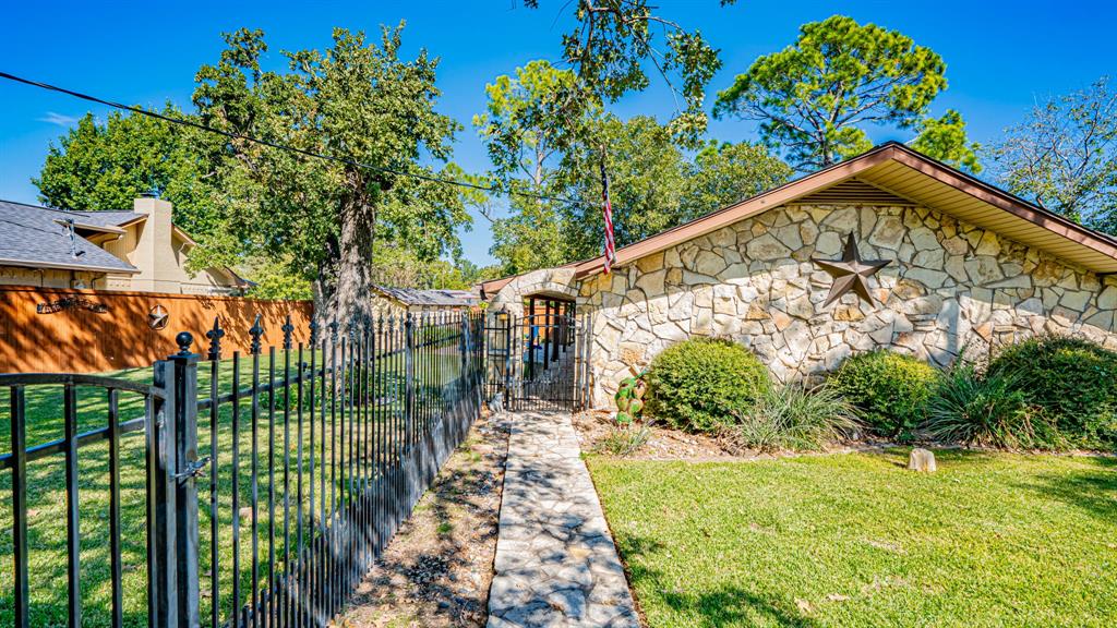 Flagstone walkway to gated entrance