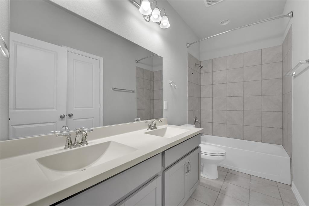 Dual vanity with integrated sinks and chrome fixtures