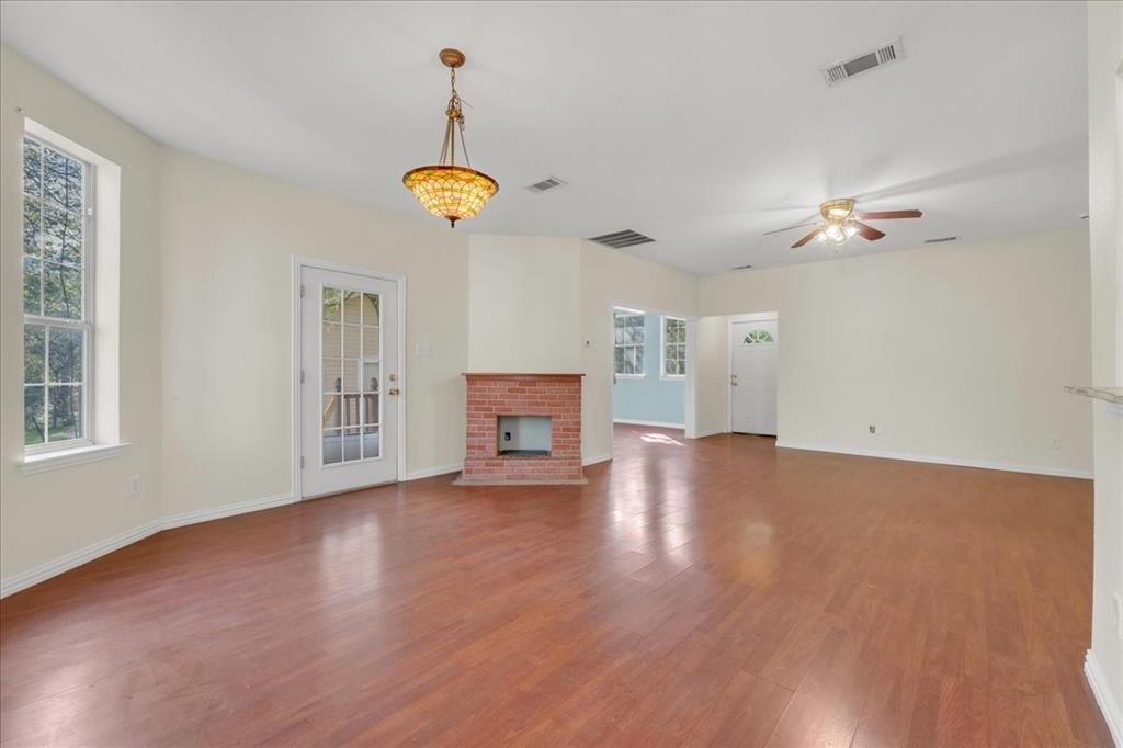 Faux fireplace in the back unit to accentuate the large open floor plan layout.