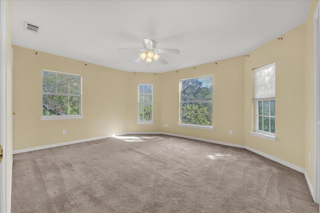 Bedroom #1 upstairs in the back unit. Offers great natural sunlight, two closets, and a view of the backyard.